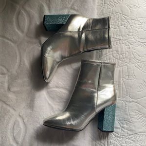 silver ankle boots with a blue sparkly heel